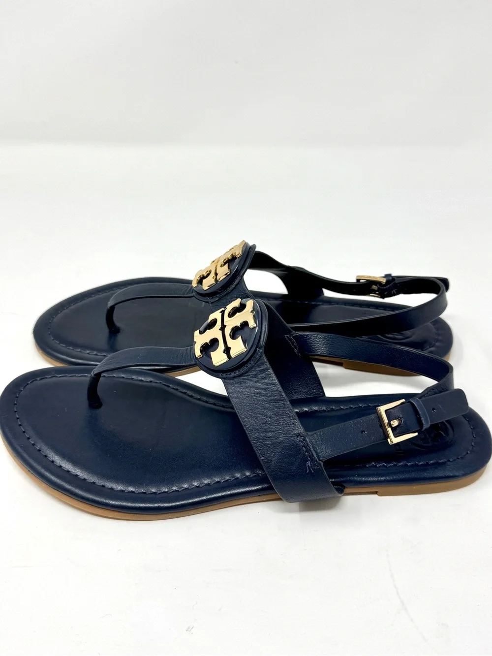 Tory Burch Bryce Navy Leather Logo Thong Sandals with Gold Logo Medallions